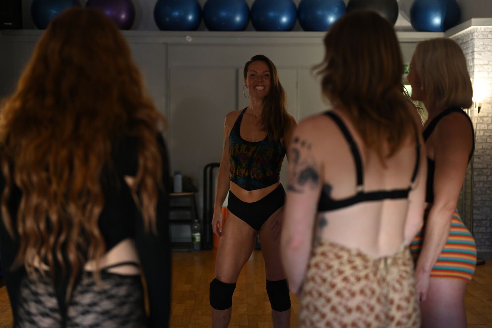 Instructor facing the class with a smile